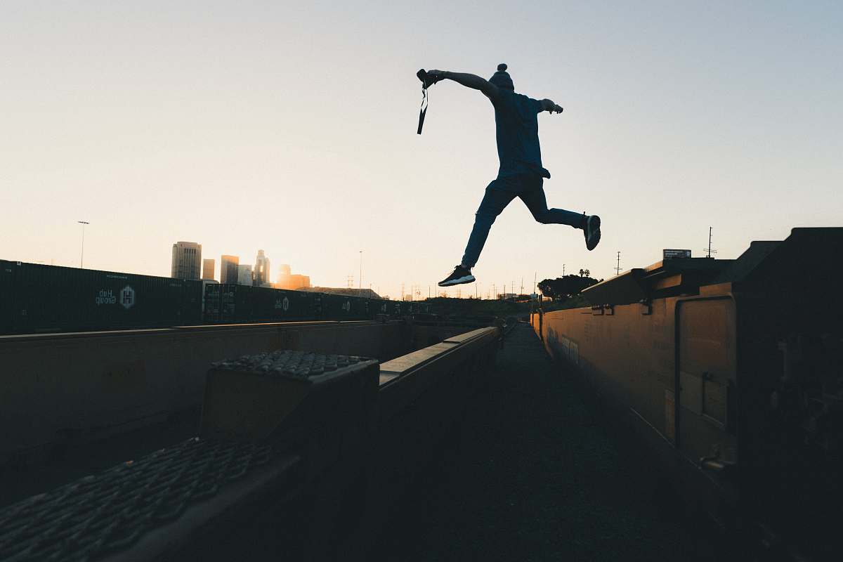 city person jump through building person